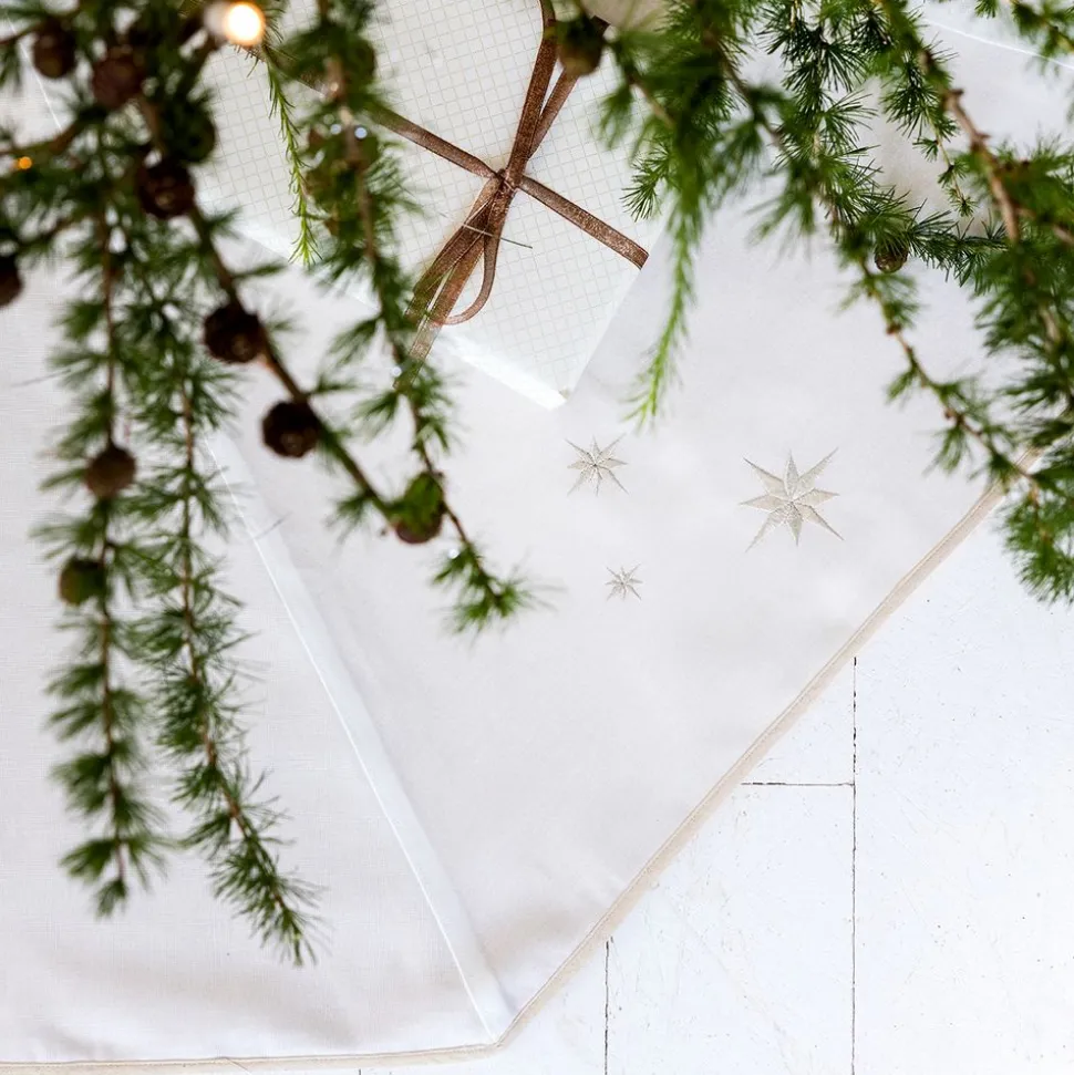 Christmas tree skirt with embroidered silver stars