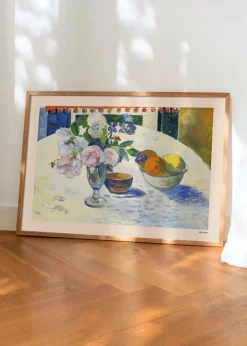 Flowers and a Bowl of Fruit on a Table